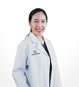 Professional portrait of female doctor in white coat smiling