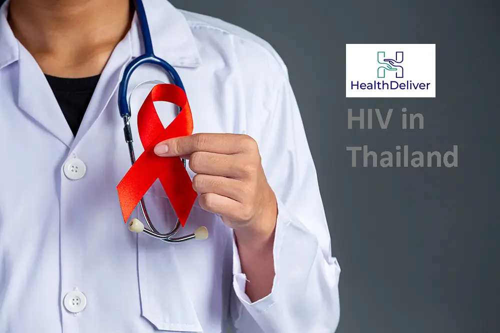 Doctor holding red HIV awareness ribbon with stethoscope