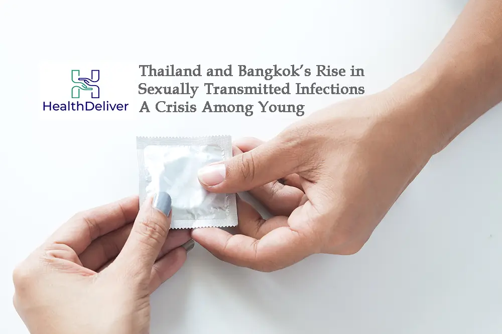 Two hands exchanging condom packet on white background