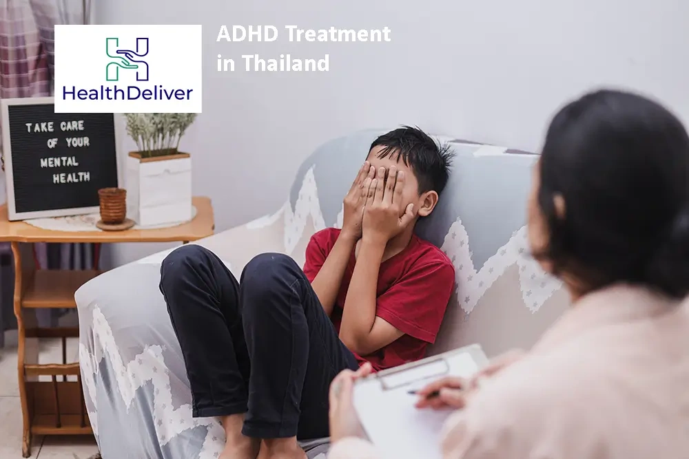 Young boy in red shirt discussing ADHD treatment with healthcare professional in Thailand clinic