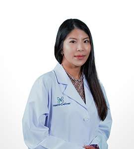 Professional woman wearing white medical coat with long dark hair