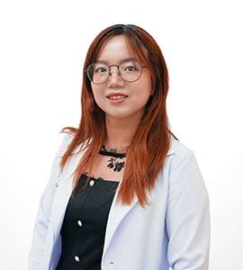 Professional headshot of female doctor wearing glasses and white coat