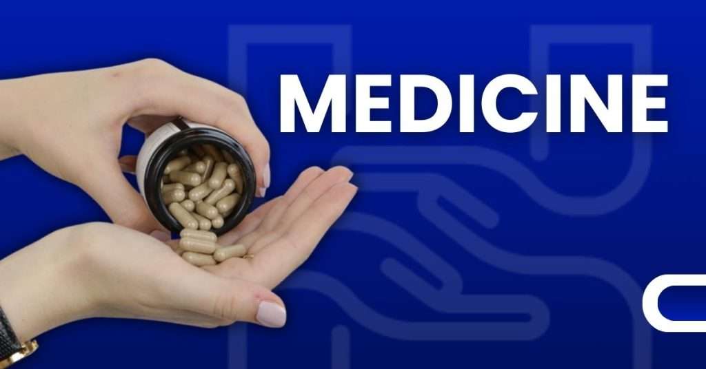 Hand holding open medicine bottle with capsule pills spilling out