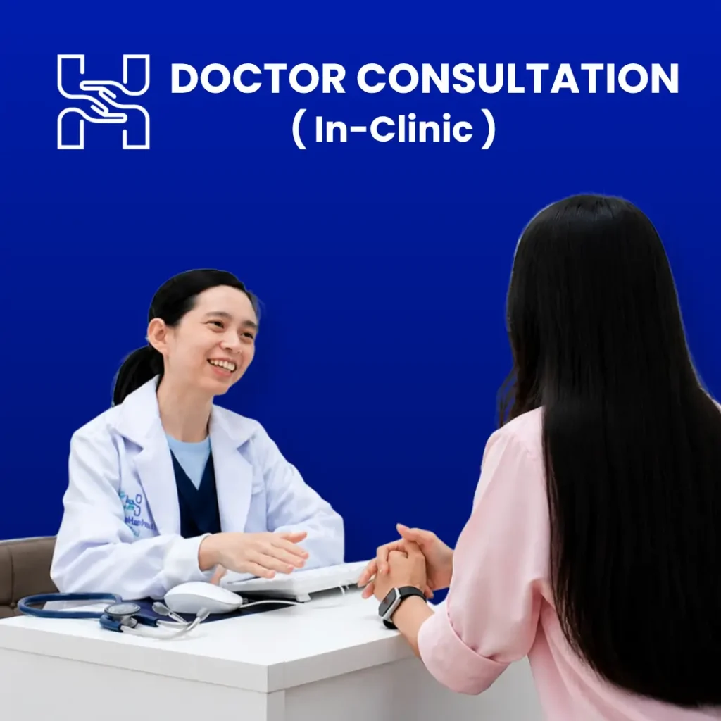 Female doctor in white coat consulting with patient at clinic desk
